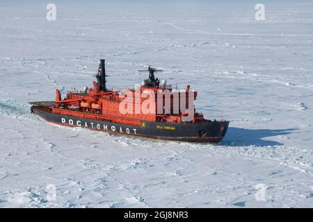 Russia. Aerial view of Russian nuclear icebreaker, 50 Years of Victory. Breaking through pack ice in High Arctic at 85.6 degrees north on the way to t Stock Photo