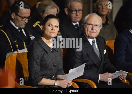 Uppsala 20141226 Crownprincess Victoria, and king Carl XI Gustaf of the Swedish royal family attends the commemoration on the tenth anniversary of the 2004 tsunami victims at the Uppsala Cathedral. Foto: Henrik Montgomery / TT / kod: 10060  Stock Photo