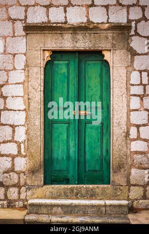 Green door at St Stephen Church, Zaton, Dalmatian Coast, Croatia. (Editorial Use Only) Stock Photo