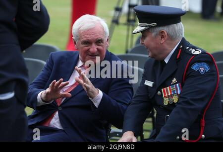 Former Taoiseach Bertie Ahern (left) and Dennis Keeley, acting Chief Officer Dublin Fire Brigade, attend a 20th anniversary event at the US Ambassador's Residence in Dublin to commemorate the lives lost during the 9/11 attacks. Picture date: Wednesday August 25, 2021. Stock Photo