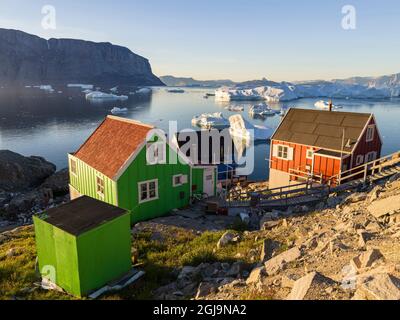 View of fjord full of icebergs towards Nuussuaq peninsula during midnight sun. Stock Photo