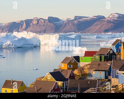 View of fjord full of icebergs towards Nuussuaq peninsula during midnight sun. Stock Photo