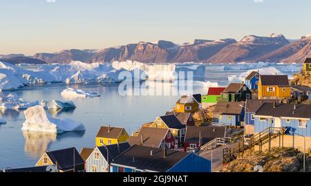 View of fjord full of icebergs towards Nuussuaq peninsula during midnight sun. Stock Photo