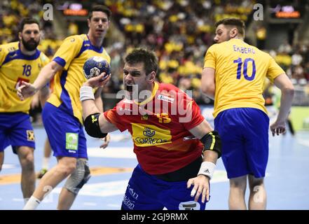 Spain's Julen Aguinagalde scoresSweden's Kim Andersson (L) and Niclas Ekberg (R) during the men's handball Olympic Qualification Tournament group 2 between Sweden and Spain at Malmo Arena in Malmo, Sweden, April 10, 2016. Photo Emil Langvad / TT