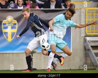 Sweden's Emil Forsberg (L) fights for the ball with Slovenia's Rene Krhin during their friendly soccer match betweeen Sweden and Slovenia at Swedbank Stadion in Malmo, Sweden, on May 30, 2016. Photo: Anders Wiklund / TT / code 10040  Stock Photo
