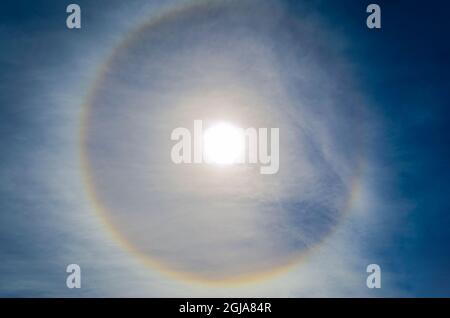 Fantastic beautiful sun halo phenomenon,or the sun with circular rainbow Stock Photo