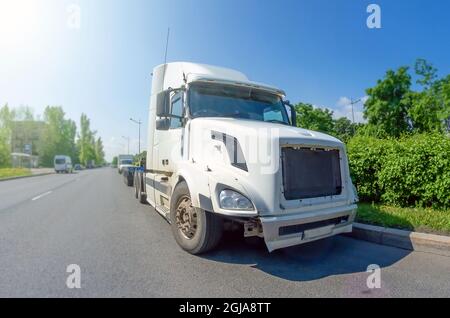 White truck without trailer and cargo on the road Stock Photo