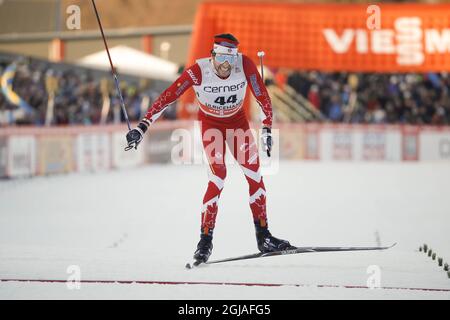Alex Harvey of Canada cross the finish line to win the men's 15km 15 km free style competition at the FIS Cross Country skiing World Cup event in Ulricehamn, Sweden, 21 January 2017. Photo: Adam Ihse / TT kod 9200 Stock Photo