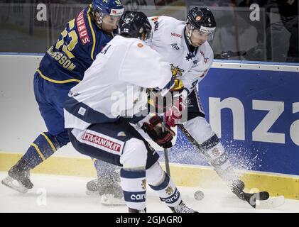 GOTEBORG 2017-02-12 Sweden's Andreas Thuresson (L) chases Finlands Niko Mikkola (C) and Tommi Kivisto (R) during the Sweden Hockey Games match Sweden vs Finland at the Scandinavium Arena in Goteborg, Sweden, February 12, 2017. Photo: Bjorn Larsson Rosvall / TT / ** SWEDEN OUT ** Stock Photo