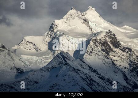 Chile, Patagonia. Snow-covered mountain peaks in sunlight. Stock Photo