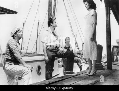 Robert Mitchum, Jack Lemmon, Rita Hayworth, on-set of the Film, 'Fire Down Below', Columbia Pictures, 1957 Stock Photo