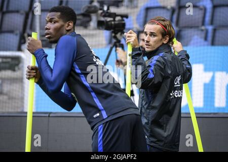 France's national soccer team players Paul Pogba (L) and Antoine Griezmann during a training session on the eve of the the Fifa World Cup qualification soccer match against Sweden at Friends Arena in Stockholm, Sweden on June 8, 2017. Photo: Henrik Montgomery / TT / code 10060  Stock Photo