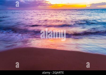 Sunlit Waves at Sunset On The  Shore of Ulua Beach, Wailea,  Maui, Hawaii, USA Stock Photo
