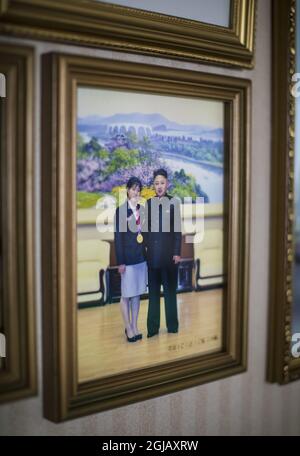 PYONGYANG 2017-04-09 A picture on the wall in the home of heavy weight lifter and olympic gold medalist Rim Jong Sim in Pyongyang, North Korea. She won her fol medal at the London Olympics and got to meet with Kim Jung Un Foto: Roger Turesson / DN / TT/ Kod: 3518 tourism, country's, country, travel, geography  Stock Photo