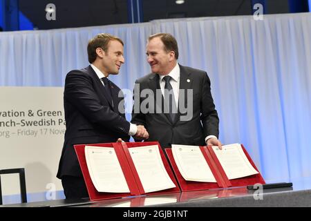 French President Emmanuel Macron and Sweden's Prime Minister Stefan Lofven signing treaty Innovation & Green Solutions a French-Swedish Partnership at Volco car factory during the EU Social Summit in Gothenburg on Friday, Nov 17, 2017. Photo: Bjorn Larsson Rosvall / TT / Code 9200  Stock Photo