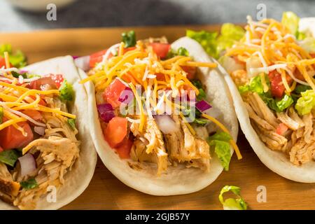 Homemade Shredded Chicken Tacos with Lettuce Cheese Tomatoes Stock Photo