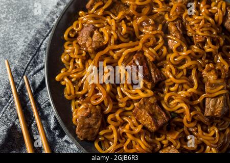 Homemade Trendy Korean Jjapaguri Noodles with Beef and Ramen Stock Photo