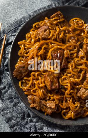 Homemade Trendy Korean Jjapaguri Noodles with Beef and Ramen Stock Photo