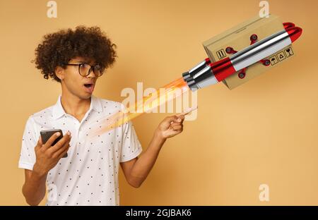Amazed man with glasses indicates something with hand Stock Photo