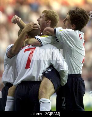 England's Paul Scholes (c) celebrates scoring the opening goal with teammates David Beckham (l) and Gary Neville (r)   Stock Photo