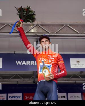 Canyon dhb SunGod’s Jacob Scott on the podium after stage five of the AJ Bell Tour of Britain from Alderley Park to Warrington. Picture date: Thursday September 9, 2021. Stock Photo