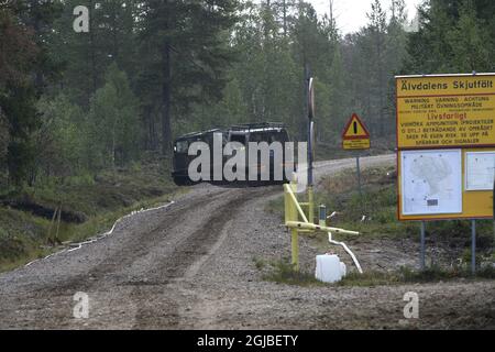 Tracked vehicles on the road which is the border to a shooting range which also works as a firebreak against the major wild fire at Alvdalens shooting range in Trangslet, Dalarna, Sweden July 21, 2018. Photo Nisse Schmidt / TT kod 40421  Stock Photo