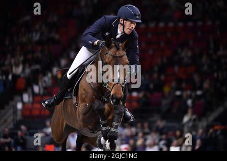 Sweden's Henrik Von Eckermann Rides Calizi During The Jumping 