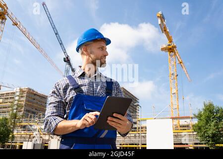 Construction Worker Or Engineer At Site Inspecting Stock Photo