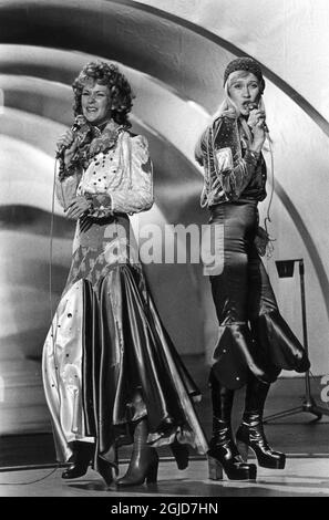Annifrid Lyngstad and Agnetha Faltskog performing on stage as Swedish pop group ABBA compete with the song Waterloo that was the Swedish entry for the Eurovision Song Contest in 1974. Stock Photo