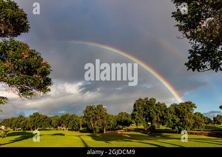 Rainbow over golf course in Koloa in Kauai, Hawaii, USA Stock Photo