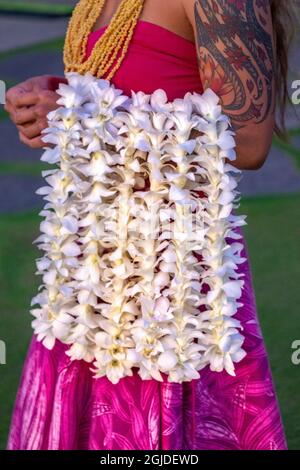 Hawaiian woman carrying leis, Hawaii, USA. Stock Photo