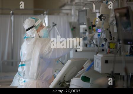 Bologna, ITALY. 10 March, 2021. Medical staff in the ICU taking care of patients affected by Covid19 inside of 'Ospedale Maggiore'. Bologna is one of Stock Photo