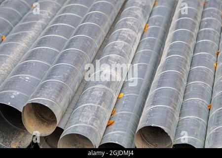 Metal pipes for ventilation on a construction site. Ventilation pipes. Close-up. Stock Photo