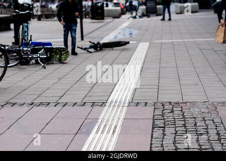 Tactile paving, tactile guideways for the visually impaired, blind people. Photo: Amir Nabizadeh / TT code 12040  Stock Photo