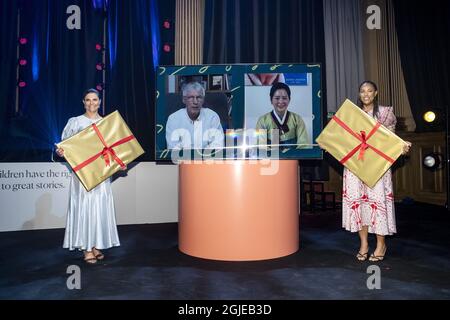 Crown Princess Victoria and host Amie Bramme Sey, on the screen this year's laureate French author Jean-Claude Mourlevat and last year's laureate South Corean picture book artist Baek Heena at the Alma Award (the Astrid Lindgren Memorial Award) and Swedish Minister of Culture and Democracy Amanda Lind. The Alma Award 2021 is a digital ceremony due to the corona pandemic. Stockholm, Sweden, 31 May 2021 Photo: Christine Olsson / TT / code 10430 Stock Photo