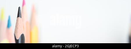 Multi-colored pencils on a white background with copy, space Stock Photo