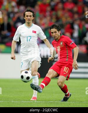 Portugal's Joao MOUTINHO and Turkey's Tuncay SANLI (L) during the group A match between Portugal and Turkey in Geneva, Switzerland. Stock Photo