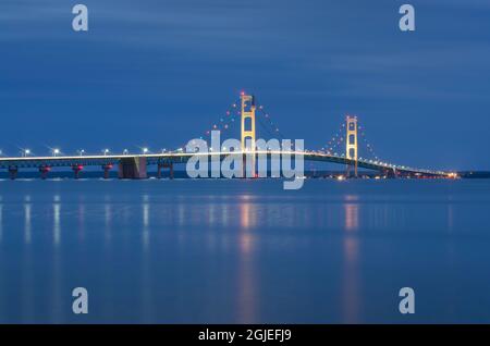 Mackinac Bridge lit up at twilight, seen from Saint Ignace, Upper Peninsula, Michigan. Stock Photo