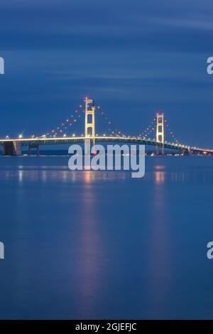 Mackinac Bridge lit up at twilight, seen from Saint Ignace, Upper Peninsula, Michigan. Stock Photo