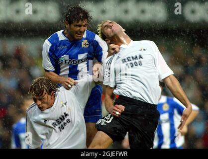Rosenborg's Azar Karadas (l) and Frode Johnsen (r) jump for a header with Deportivo La Coruna's Hector Berenguel (c)  Stock Photo