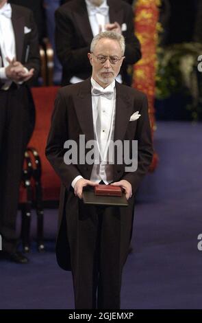 John Maxwell Coetzee receiving the Nobel Prize in Literature 2003 from King Carl Gustaf of Sweden, at the Nobel ceremony in the Stockholm Concert Hall, Stockholm, Sweden Stock Photo