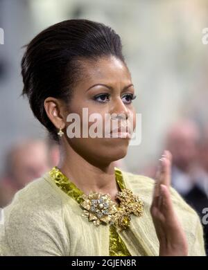 US First lady Michelle Obama applauds during the Nobel award ceremony in the City Hall of Oslo, Norway, December 10, 2009 when her husband US President Barack Obama receives the Nobel Peace Prize of 2009. Stock Photo