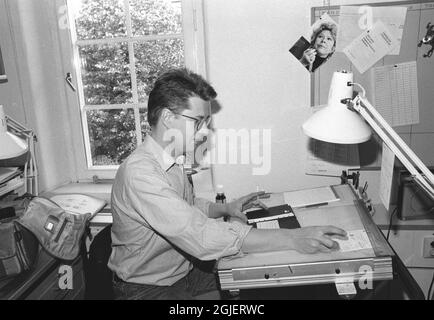 Swedish crime writer Stieg Larsson is seen at work as a news graphic illustrator at the TT Feature and Photo desk in Stockholm, Sweden. Stock Photo