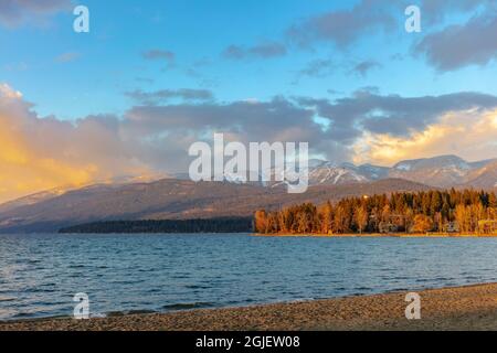 Sunset clouds over Whitefish Lake in early winter in Whitefish, Montana, USA. Stock Photo