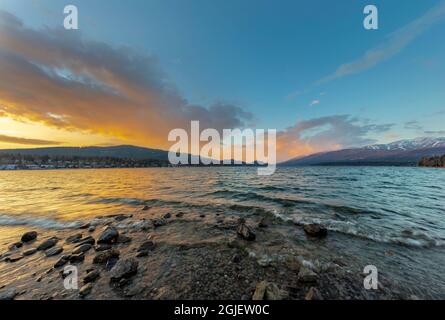 Sunset clouds over Whitefish Lake in early winter in Whitefish, Montana, USA. Stock Photo