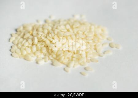 White Sesame seeds are flat, pear-shaped seeds with an off-white color Stock Photo