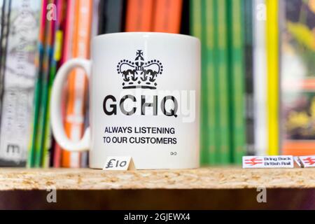 Mug with message, GCHQ always listening to our customer Stock Photo
