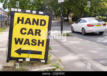 Sign for Hand Car Wash on road side London England Stock Photo