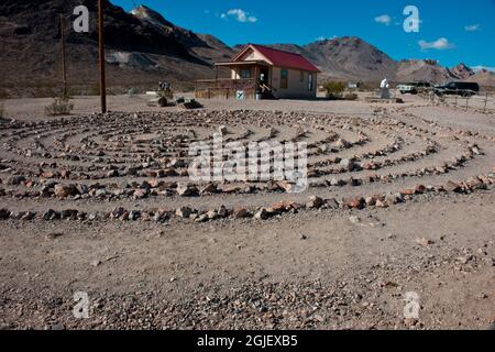 USA, Nevada, Rhyolite, concentric stone circles and museum building Stock Photo