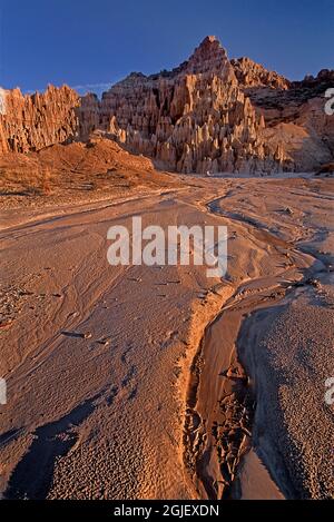 USA, Nevada, Cathedral Gorge State Park. Arid formations and plain at sunrise. Stock Photo